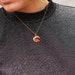 Anja Onstenk reviewed Necklace gold plated charm small - nature jewelry - pendant with birch wood - handmade - simple jewellery- necklace for her