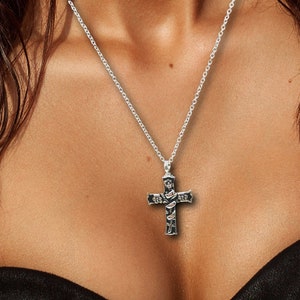 Personalized Cross Urn Necklace, Stainless Steel Cross Adorning Tri Flower Ribbon with Black enamel Inlay, Heartfelt Gift for Men or Women.