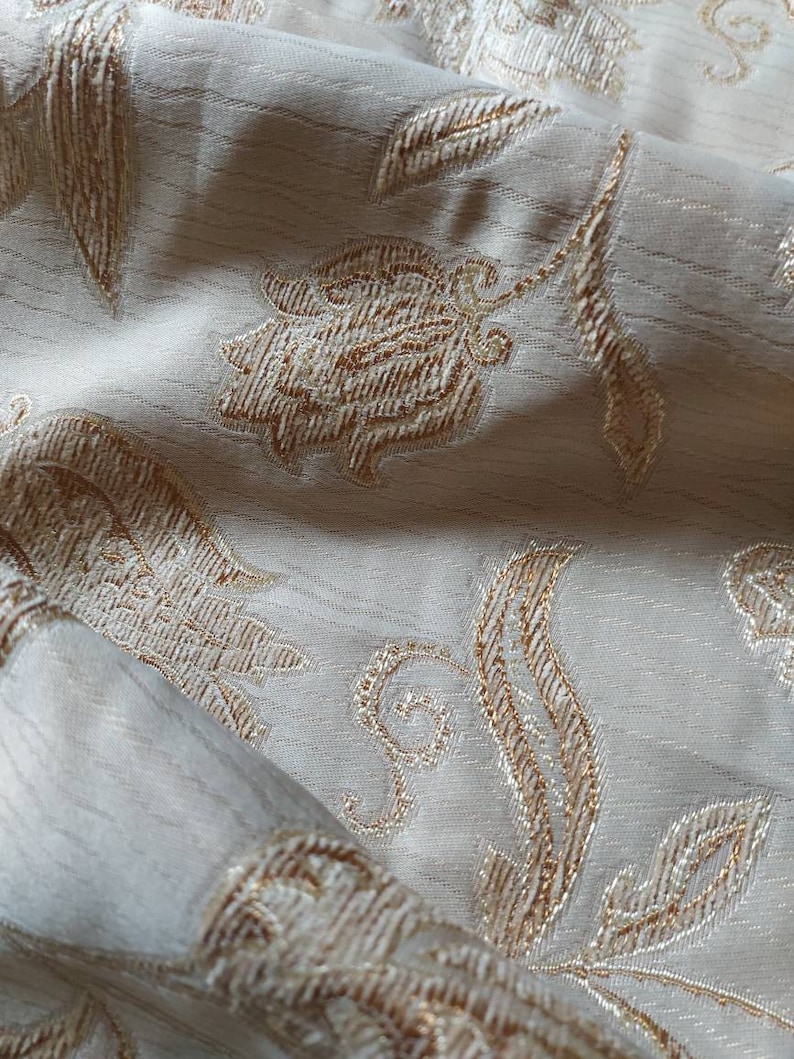 Lovely soft grey fabric with stylized flowers embossed and edged in pale brown and grey home decor fabric ships worldwide
