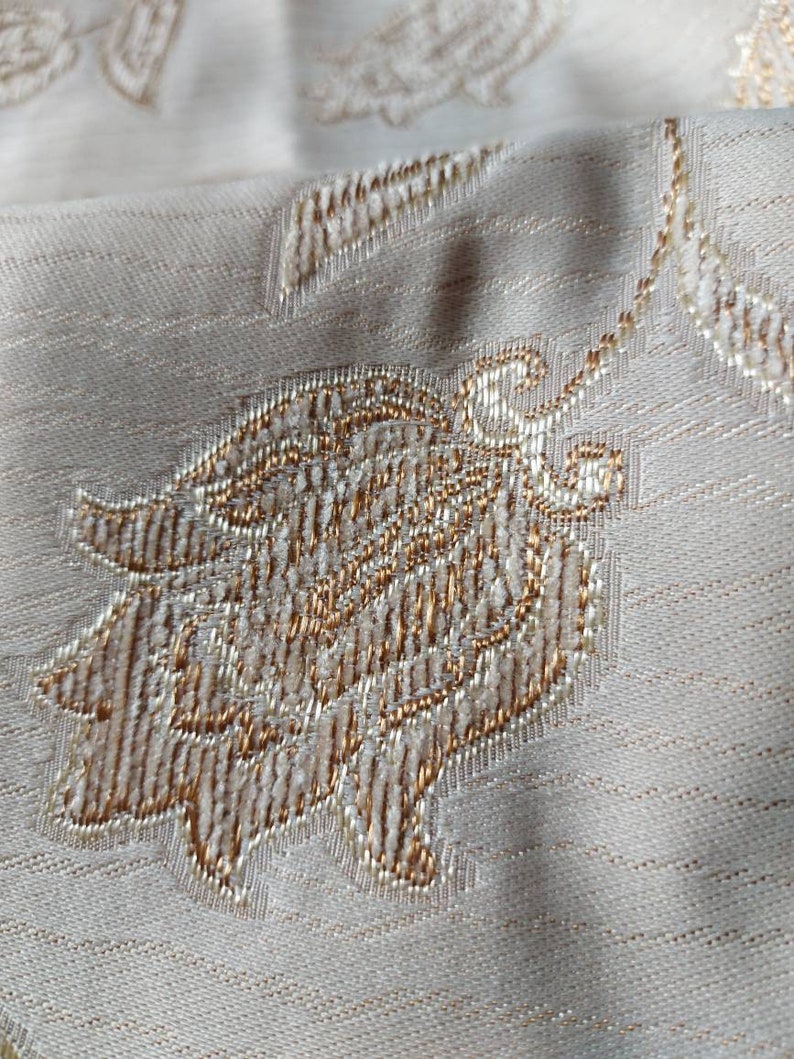 Lovely soft grey fabric with stylized flowers embossed and edged in pale brown and grey home decor fabric ships worldwide