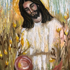 May include: A painting of Jesus Christ with long brown hair and a beard, wearing a white robe. He is standing in a field of yellow flowers and holding a red scroll in his hand.