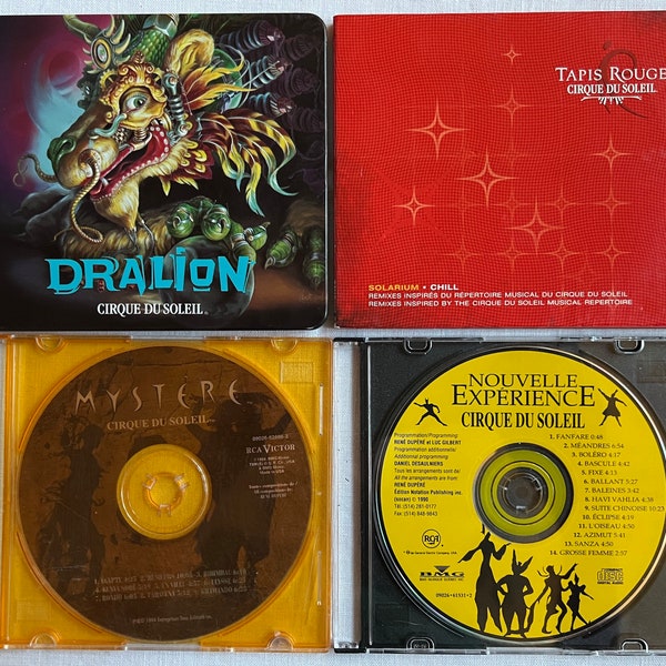 4 Cirque du Soleil Music CDs, Dralion in Steelcase, Tapis Rouge, Mystere, Nouvelle Expérience Plus Lanyard