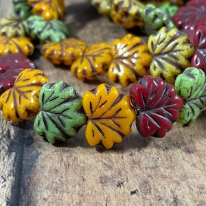 May include: A set of three ceramic nesting bowls in graduating sizes. The bowls are white with a speckled, textured finish and feature a slightly flared rim. The largest bowl measures approximately 8 inches in diameter.