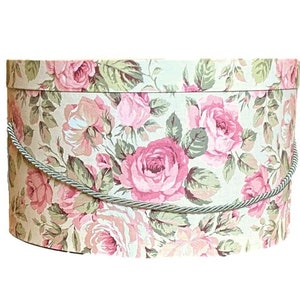 Caja grande para sombreros de 43 x 23 cm en tela floral rosa y beige.