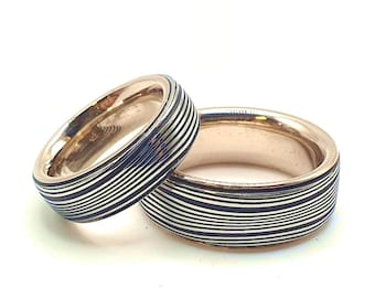 Partner wedding rings made of layered damask combined with 585 gold