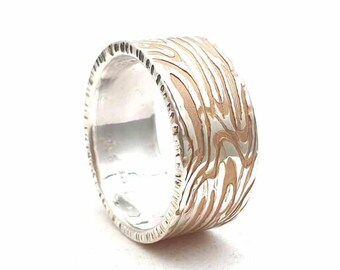 Silver ring with structure partially gold-plated unisex