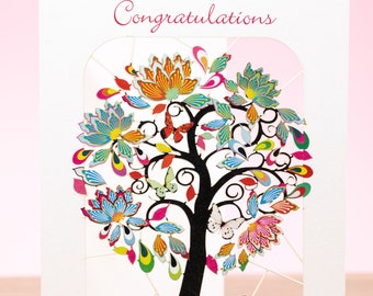 May include: A white card with the word "Congratulations" printed in black at the top. A colorful, intricate paper cut-out of a tree with butterflies is in the center of the card. The tree is surrounded by a white border.
