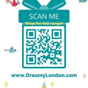 May include: A teal blue gift box with a white bow and a QR code that says "SCAN ME Shop for full range!"  The website address www.DreamyLondon.com is below the QR code.  The image has a London skyline with hot air balloons and birds.