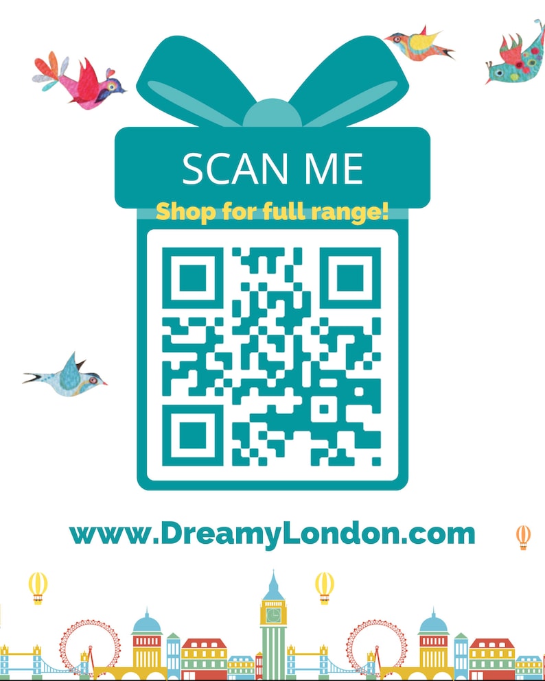 May include: A teal blue gift box with a white bow and a QR code that says "SCAN ME Shop for full range!"  The website address www.DreamyLondon.com is below the QR code.  The image has a London skyline with hot air balloons and birds.