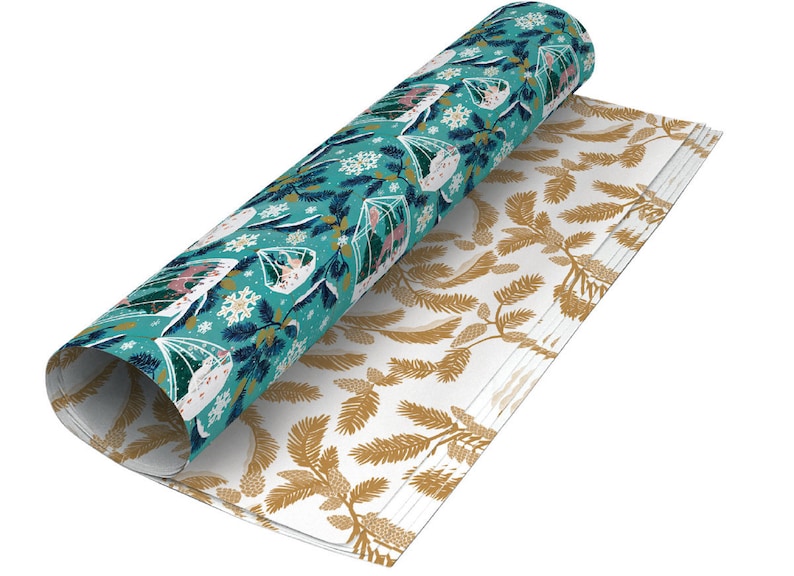 May include: Two rolls of wrapping paper with a winter theme. One roll features a teal background with white snowflakes, pine branches, and small houses. The other roll has a white background with gold pine branches.