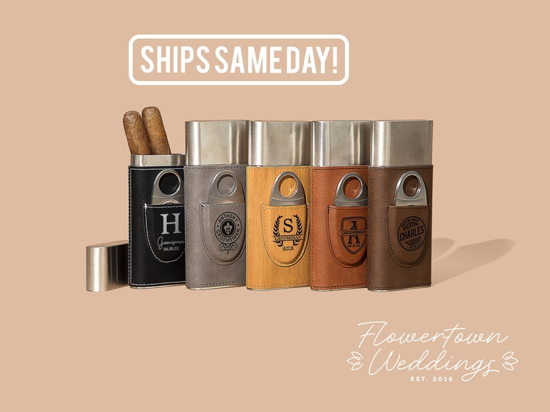 May include: Six personalized cigar cases with different leather and wood finishes. Each case features a metal cigar cutter and a pocket for storing cigars. The cases are engraved with initials and names.