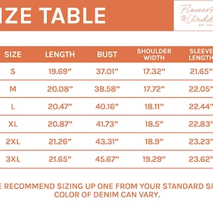 May include: Size chart for a garment with measurements in inches for length, bust, shoulder width, and sleeve length. Sizes include S, M, L, XL, 2XL, and 3XL. The chart also includes the text "We recommend sizing up one from your standard size. Color of denim can vary."