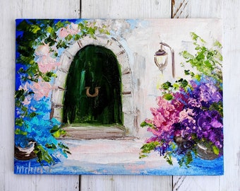 May include: A painting of a green door with a horseshoe knocker, surrounded by pink and purple flowers. The door is set in a white stone archway with a white wall and a lamp on the right side.