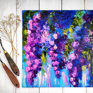 May include: Abstract painting of purple and blue flowers with a textured brushstroke style. The painting is on a canvas and has a white background.