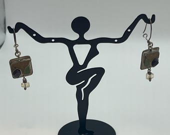 These are vintage dangle earrings with a square component and bead.