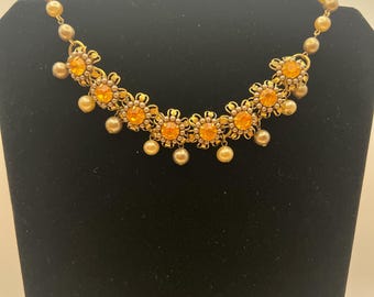 Vintage gold-tone necklace with amber crystals and faux pearls.