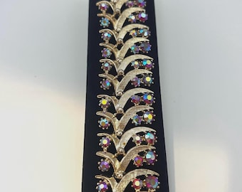 Signed ART (Arthur Pepper) gold-tone bracelet with AB rhinestones.