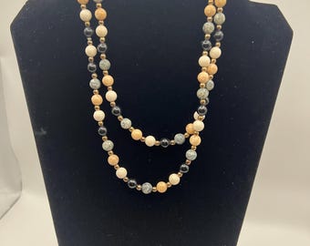 Vintage Avon Desert Sands marbleized bead necklace with gold-tone spacers.