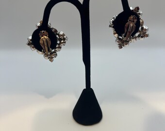 Vintage silver-tone cluster rhinestone clip-on earrings.
