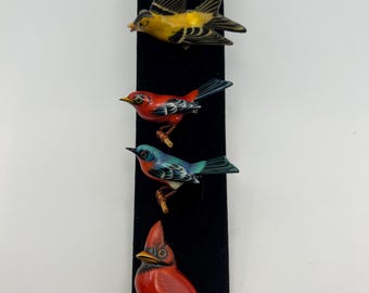 Set of five  hand-carved and painted Takahashi bird brooches.