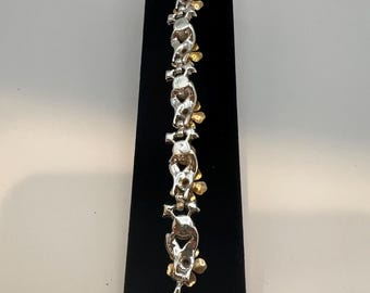 Vintage gold-tone floral bracelet with faux pearls and rhinestones.