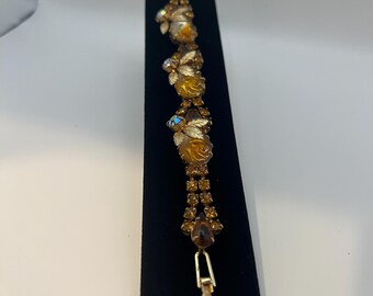 Vintage gold-tone bracelet with carved amber roses and rhinestones.