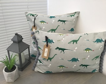 Housses de coussin faites main en tissu « Dinosaure » par Sophie Allport