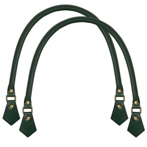 May include: A pair of dark green leather handbag handles with gold metal hardware. The handles are designed to be attached to a bag.