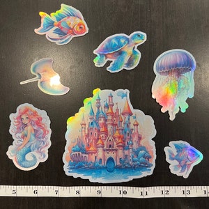Holographic underwater fantasy stickers for laptop, waterbottle, school supplies, and more.