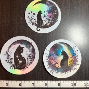 Holographic cat stickers for laptop, waterbottle, school supplies, and more.