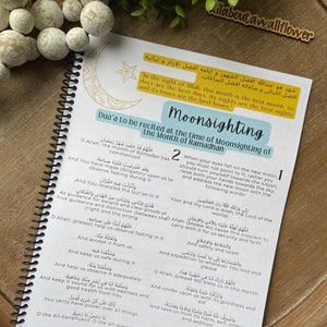 May include: A page from a book with a blue and yellow design. The page features a dua, or Islamic prayer, to be recited at the time of moon sighting for the month of Ramadan. The dua is written in Arabic and English. The page also includes a crescent moon and star graphic.