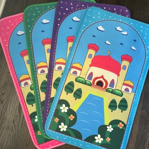 May include: Four colorful prayer mats with a mosque design. Each mat features a different border color: pink, green, purple, and blue. The mats have a blue sky background with clouds and musical notes.
