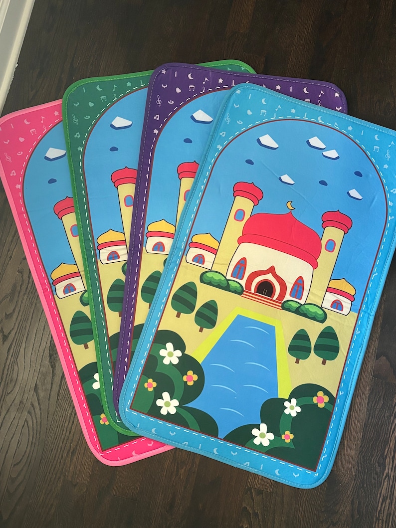 May include: Four colorful prayer mats with a mosque design. Each mat features a different border color: pink, green, purple, and blue. The mats have a blue sky background with clouds and musical notes.