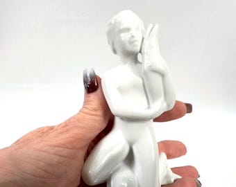 Sea child – porcelain figurine by harald salomon for rörstrand