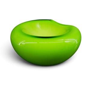 May include: A smooth, rounded bowl with a vibrant lime green finish. The object features a wide, circular opening at the top and a curved, continuous exterior surface that tapers toward the base, creating a soft, organic, and symmetrical shape.