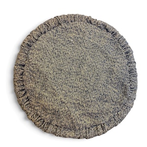 May include: A circular cushion featuring a dark charcoal gray fabric with a subtle gold-toned speckled texture. The edge of the cushion is finished with a gathered, pleated border made from the same dark gray and gold-flecked material.