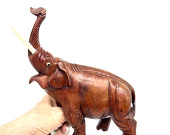 Vintage hand-carved wood elephant figurine – folk art sculpture with painted eyes & faux ivory tusks
