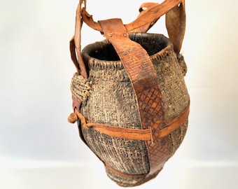 Tribal Water Vessel – Woven & Mud-Coated Jug with Leather Strap – Ethnographic Decor