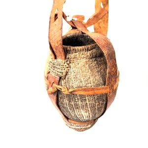 Tribal Water Vessel – Woven & Mud-Coated Jug with Leather Strap
