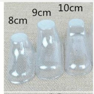 May include: Set of six clear plastic shoe forms in various sizes, ranging from 8 cm to 12 cm. The forms are designed to help maintain the shape of shoes.