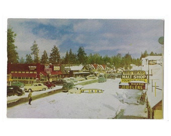 Big Bear California Snow 1950s City Scene with Vintage Cars and Malt Shop Unused Postcard