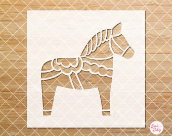 May include: A white stencil featuring a Dala horse design. The horse is depicted in a traditional style with detailed cut-out patterns. The stencil is on a light wood grain background with a diamond pattern. The text "COPYRIGHT 2025" is visible.