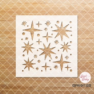 May include: White stencil with a repeating pattern of stars and dots. The stencil is designed for crafting and decorating.
