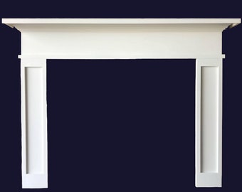 May include: White painted wooden fireplace mantel with a simple design. The mantel has a flat top with a small lip and two vertical panels on either side.