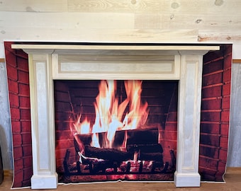 May include: A white painted wooden fireplace mantel with a brick background and a realistic image of a fire burning inside.