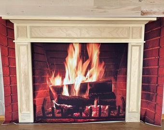 May include: A white wooden fireplace mantel with a brick background and a realistic image of a fire burning inside.