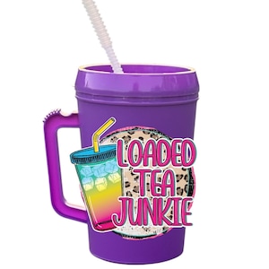 May include: A purple tumbler with a handle and a white straw. The tumbler has a graphic of a colorful drink with ice and the words "LOADED TEA JUNKIE" on it.