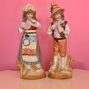 Pair of Vintage Biscuit (bisque) Porcelain Figurines holding hearts