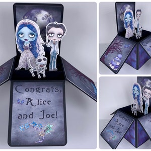 May include: A pop-up card with a black background and a purple and gray design. The card features a 3D pop-up of a bride and groom dressed as characters from the movie "The Nightmare Before Christmas". The card reads "Congrats, Alice and Joe!"