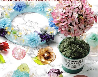 May include: A craft guide titled HOW TO MAKE DIPART First Resin Dip Art Seasonal Flowers Made From Wire featuring a blue floral wreath, a pink resin flower topiary in a green pot labeled FLOWERS GARDEN, and various wire and resin flower ornaments.